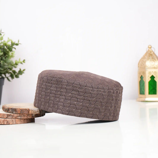 Brown prayer cap with intricate geometric pattern for religious ceremonies