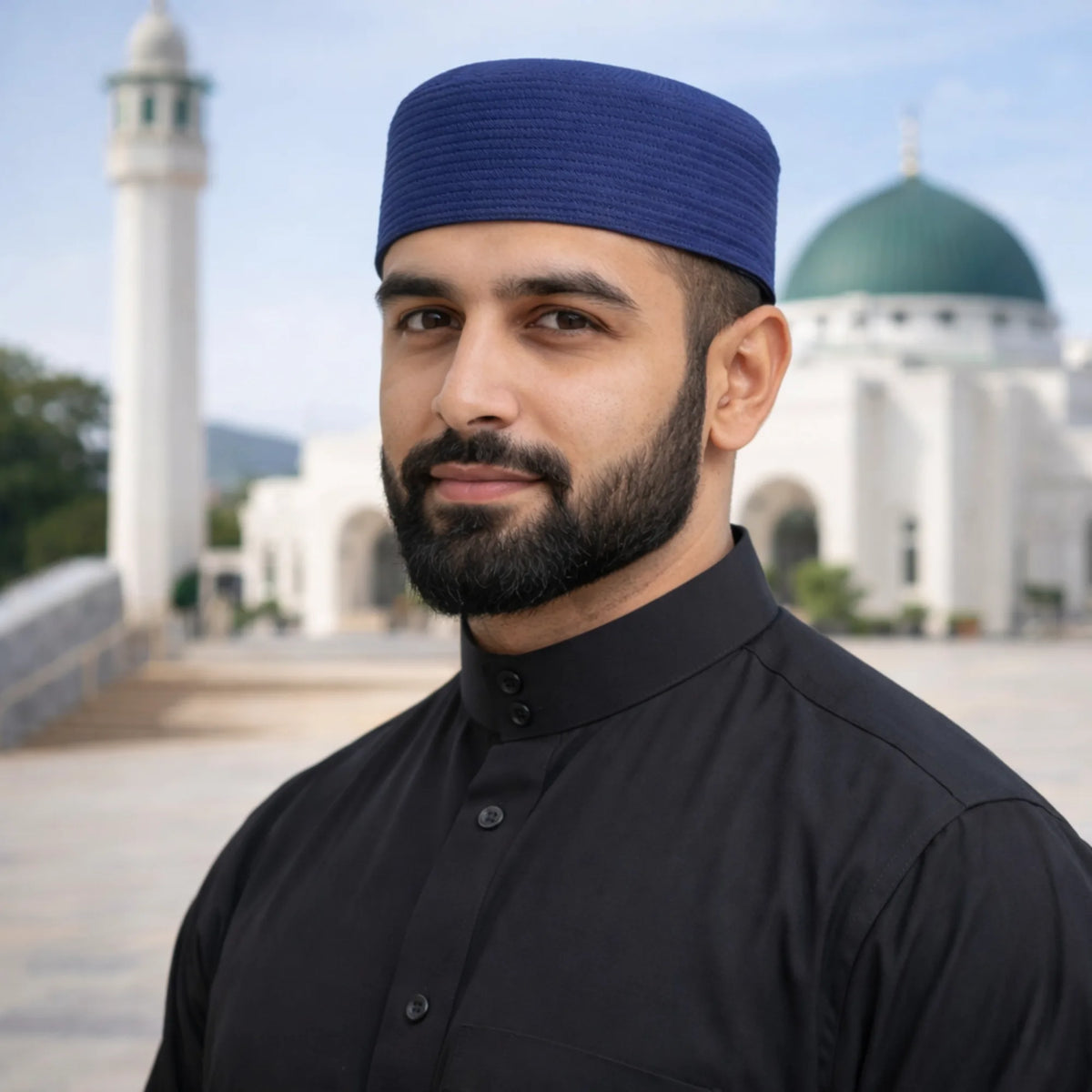 Man wearing blue prayer cap, Islamic attire, mosque background