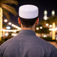 Man in traditional white prayer attire at Mecca
