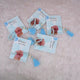 Five blue Little Hands Tasbeeh Keepsakes with personalized cards, ideal for Aqiqah gifting and religious ceremonies.