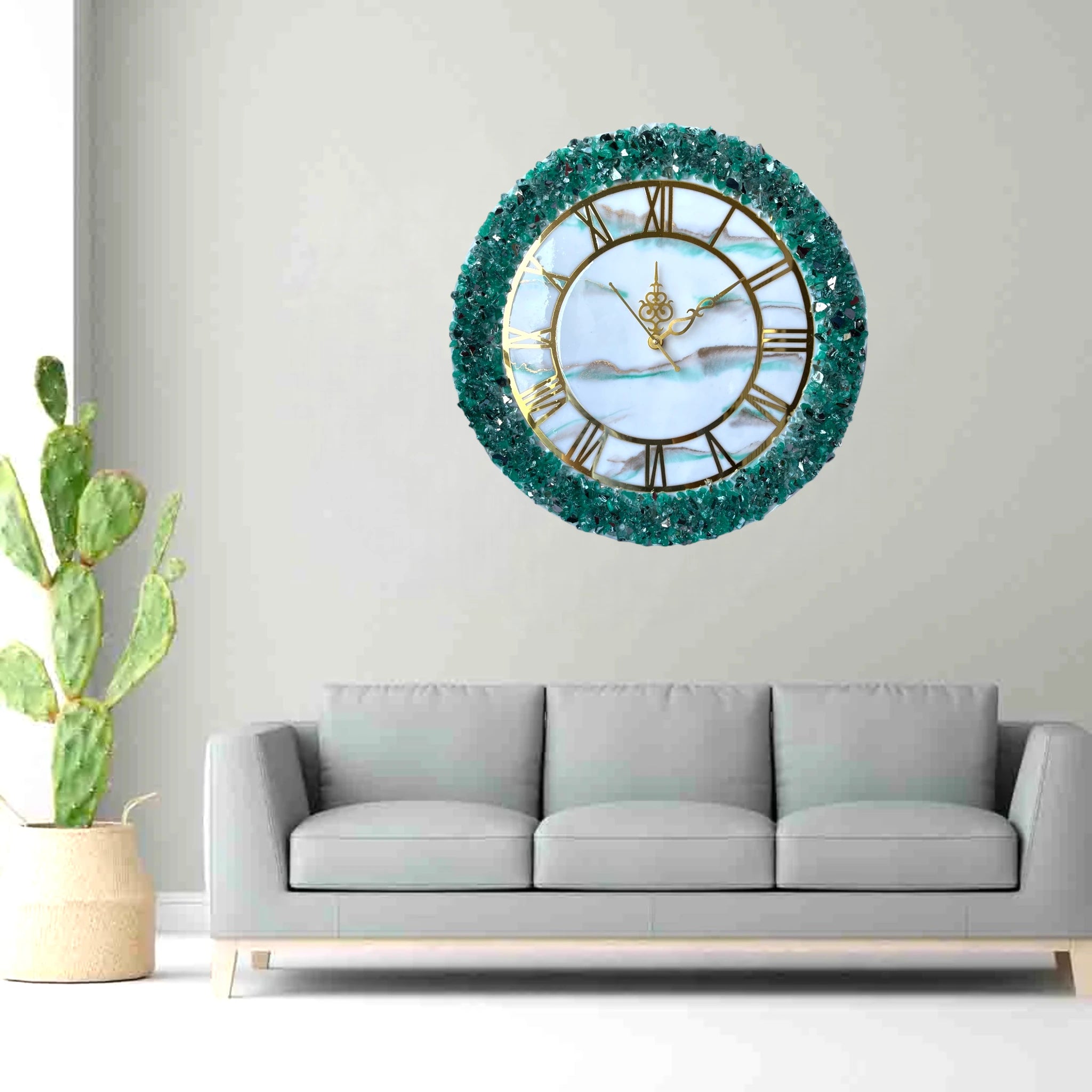 Green Geode Wall Clock - Timeless Elegance | Resin Decor mounted above a grey sofa, showcasing its luxurious green crystal border and gold Roman numerals. Main image