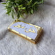 White and gold Haqq Mehr envelope with intricate border, ideal for presenting bridal Mehr. A refined wedding gift accessory.