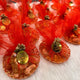 Red-themed Mix Dry-Fruit Nikah Favor Gift Trays with personalized gold tags, wrapped in red netting and filled with assorted dry fruits.