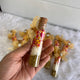 Hand holding a Shahi Mix Sounf Bottle filled with colorful sweets and fennel, designed for Nikah wedding favors and traditional gifting.