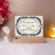 Open beige Nikah Nama velvet box with printed Nikah Nama and floral design, ideal for ceremonial wedding gift hampers.