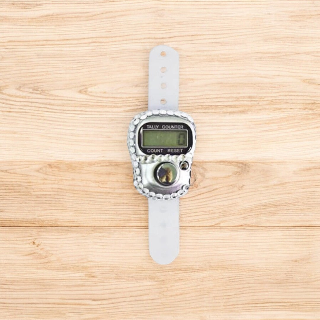 Silver digital tasbeeh counter with wrist strap, ideal for religious gifting and ceremonial use.