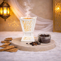 White Majesty Bakhoor Burner with Arabic calligraphy design, releasing aromatic smoke, ideal for Ramadan & EID home decor and gifting.