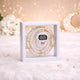 alt="White Transparent Tasbeeh Combo Favor containing a 100-bead pearl tasbeeh and a matching digital counter inside a clear square PVC box."