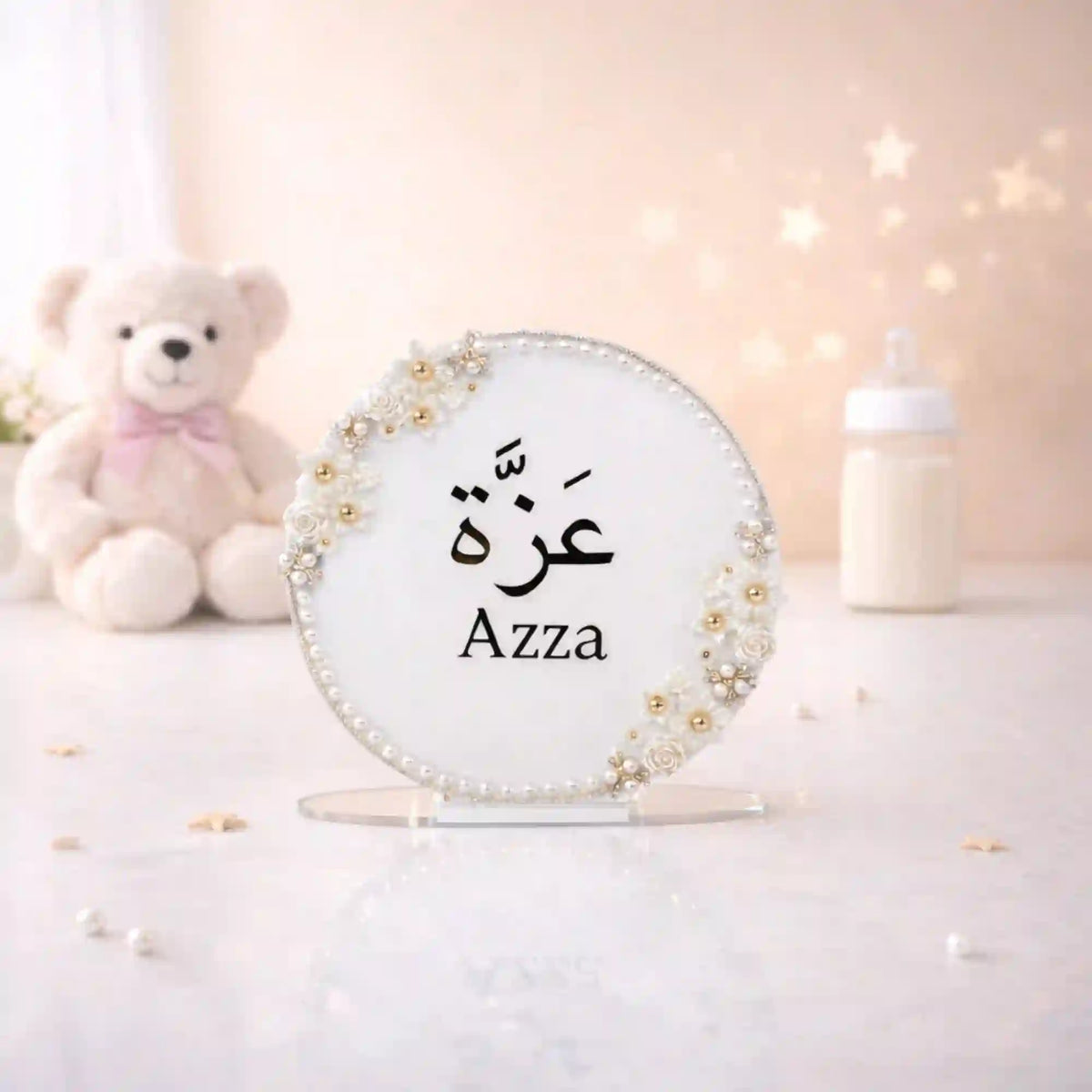 Kids Floral Pearl Name Frame with Stand featuring the name 'Azza' in Arabic and English, adorned with white roses and pearls, ideal for nursery decor.
