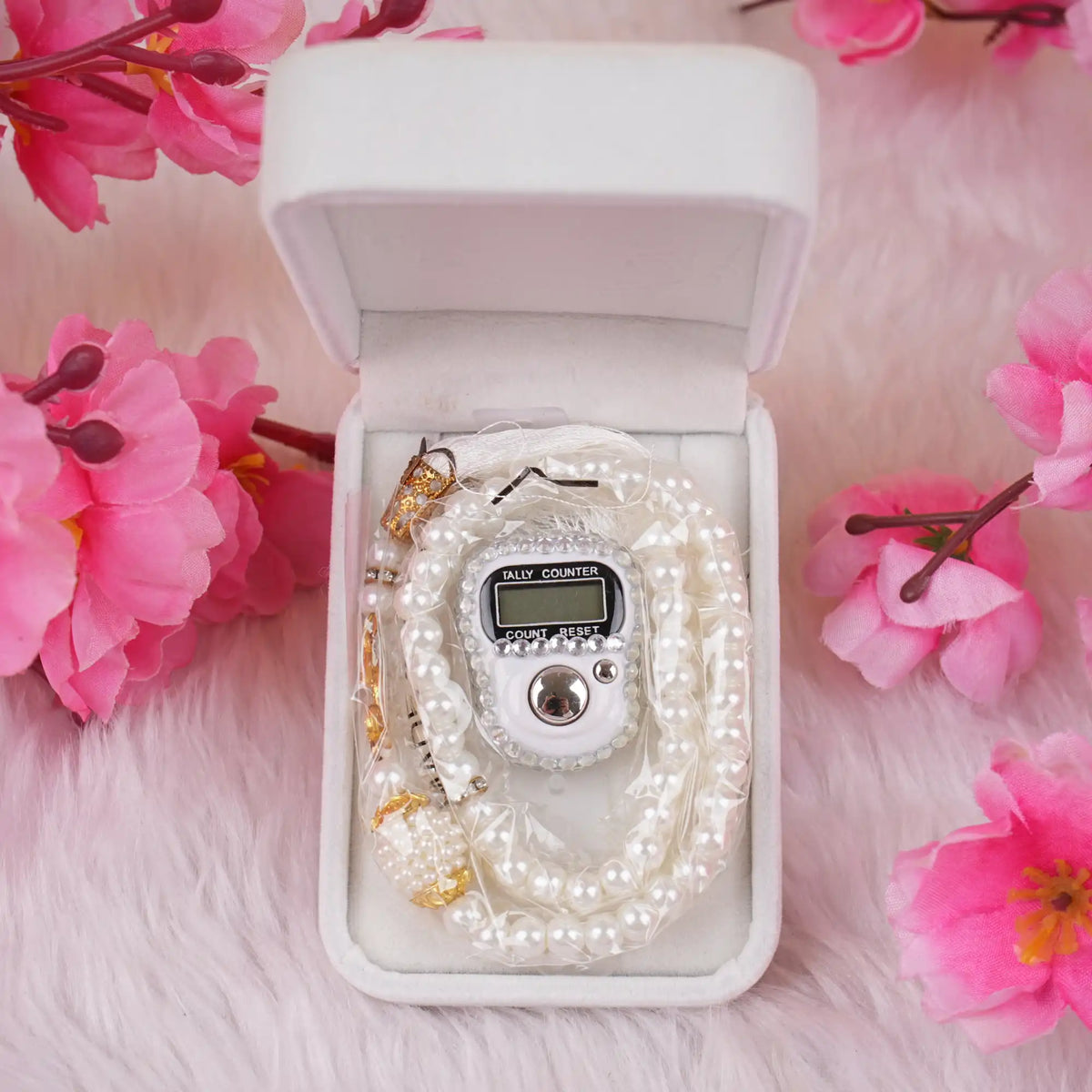 Pearl Tasbeeh and digital counter neatly placed in a white velvet box, part of the Velvet Tasbeeh Combo Set for Islamic gift occasions.