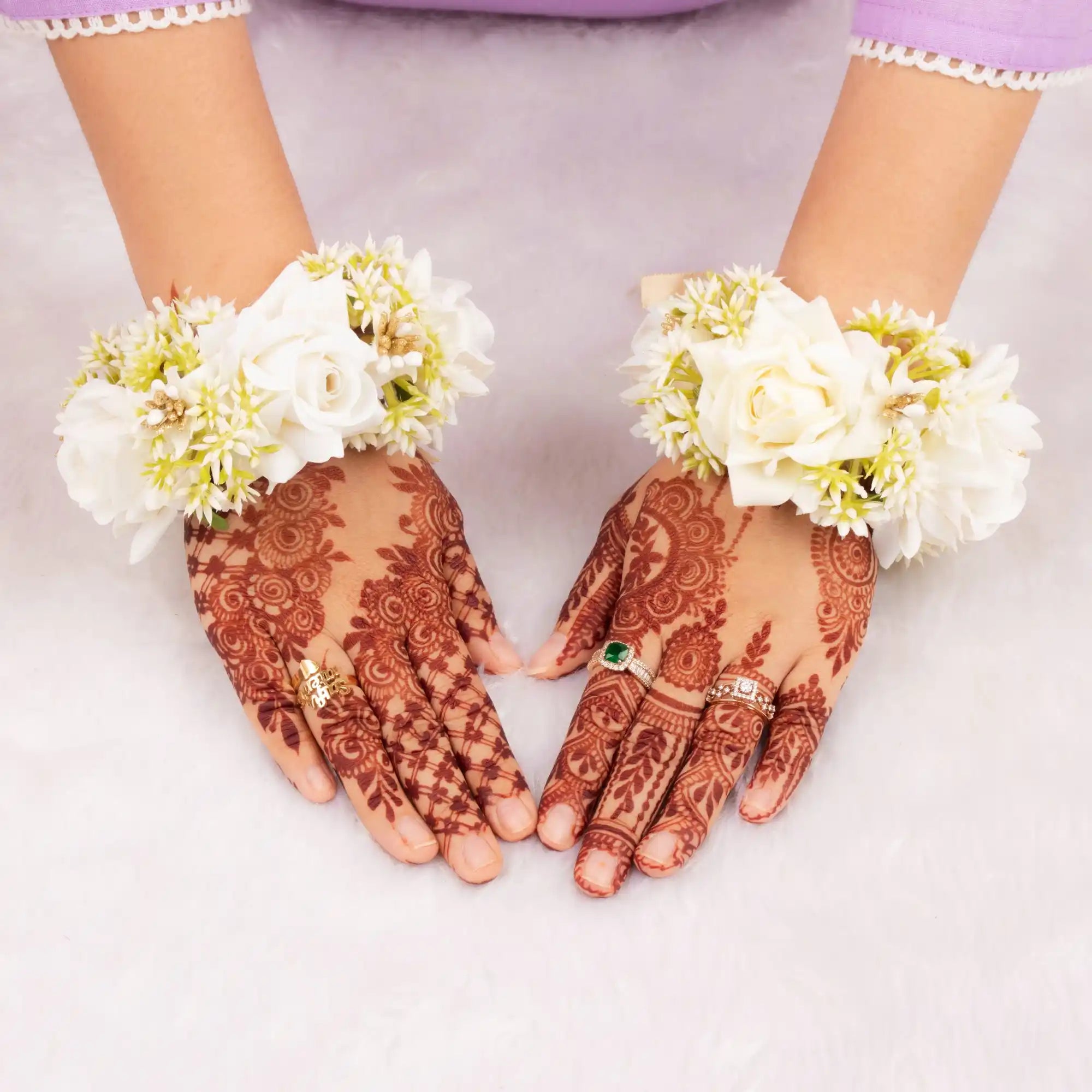 Handcrafted Floral Gajra - Wedding Accessory worn on wrists with intricate mehndi, featuring white roses and jasmine buds for traditional ceremonies. Main image