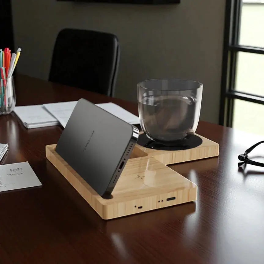 Back view of Willow 3.0 Wireless Charger - Cup Warmer & Phone Stand in use, warming a cup and supporting a phone in landscape mode on a work desk.