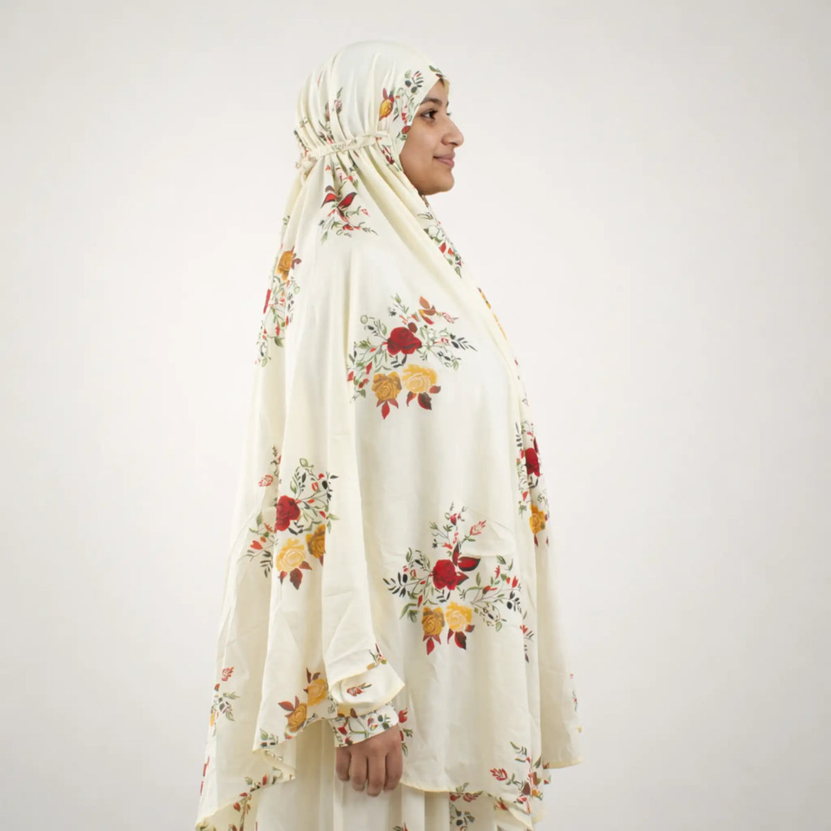 Side profile of Prayer Dress 12 with floral print, highlighting modest design and versatile coverage for everyday and prayer use.
