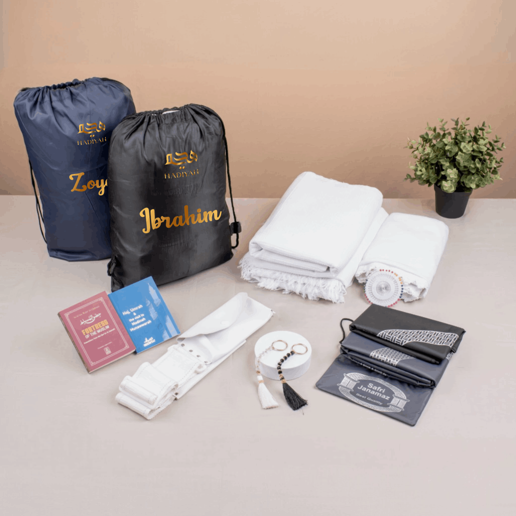 Ziyarat Companion Set - Umrah Hajj travel gift for couples with Ihram, hijab, tasbeeh, janamaz, and essentials in personalized drawstring bags. Main image
