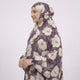 Side profile of woman wearing floral cotton prayer dress with head covering