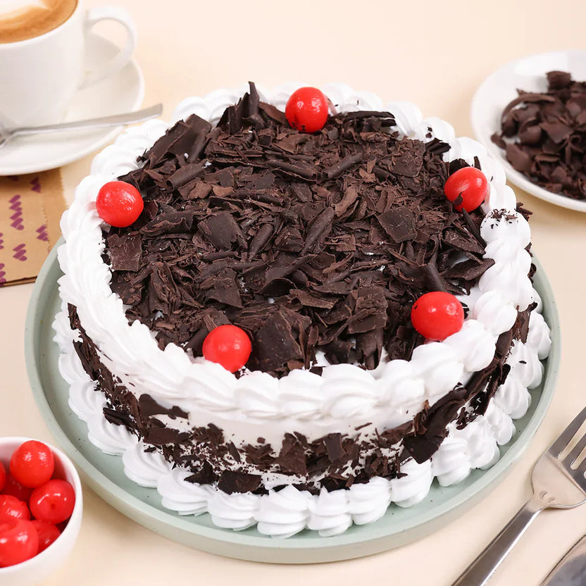 Buy Black Forest Cake Online - Chocolate & Cherry Delight with whipped cream, chocolate shavings, and cherries on top. Ideal for birthdays or parties. Main image