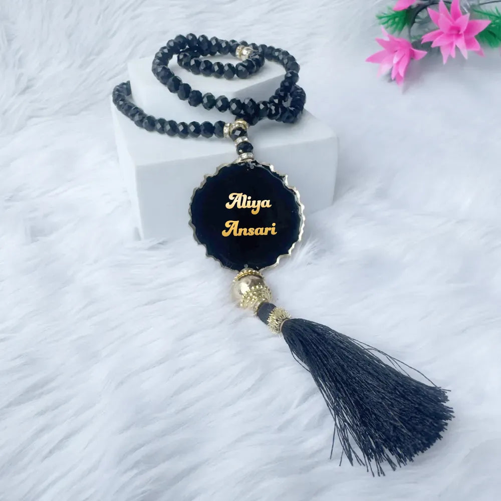 Custom acrylic tasbeeh with black beads and name engraving from the Luxury Bridal Gift Hamper. Ideal for personalized Islamic gifts.