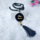 Personalized black Tasbeeh with custom name tag from the Black Sequence Rehal Hamper - thoughtful Islamic gift.
