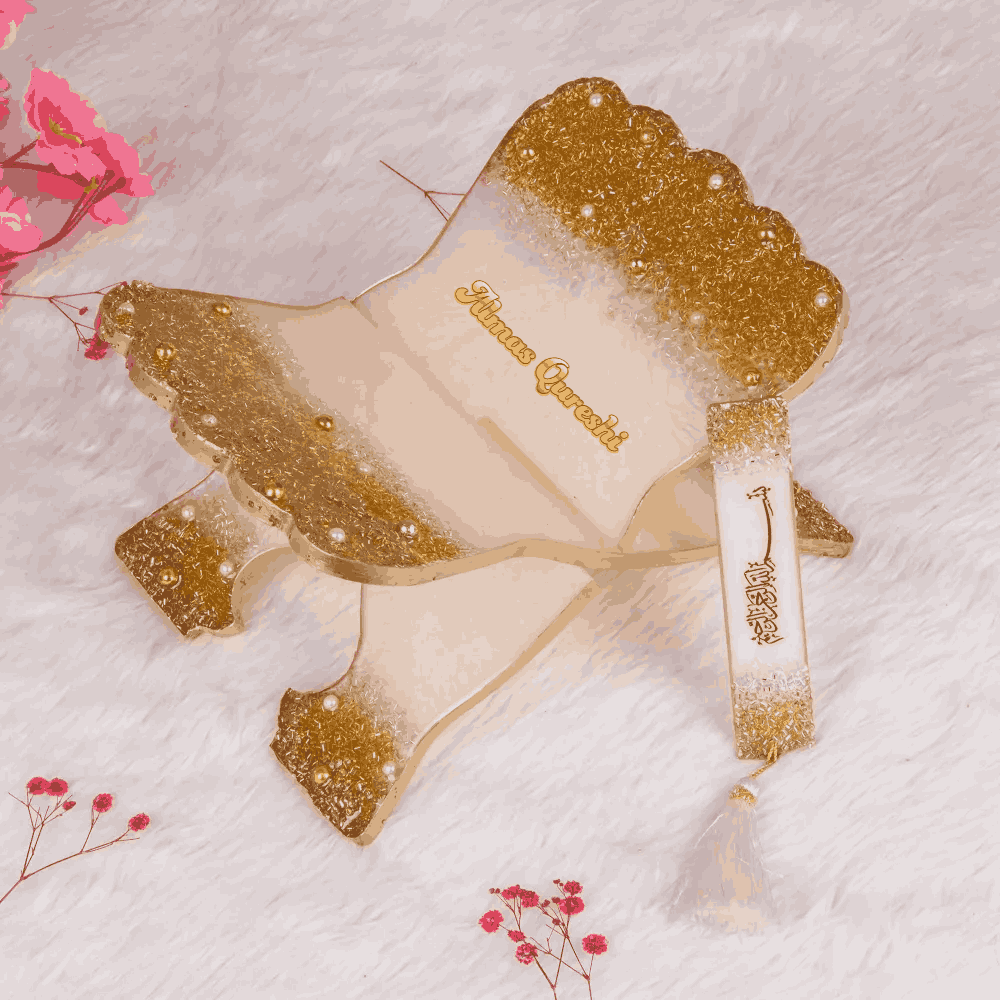Handmade offwhite Quran stand with gold sequins and personalized bookmark, a thoughtful Hajj or Umrah gift.