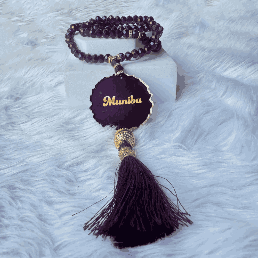 Customizable purple tasbeeh with name 'Muniba' in gold, from the Purple Sawab-e-Jariya Gift Set. Personalized Islamic gift option.