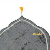 Decorative headscarf with intricate patterns and 'Abdullah' branding on a white background
