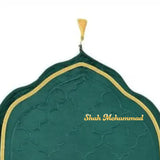 Green prayer mat with gold border and 'Shah Mohammad' branding on a white background