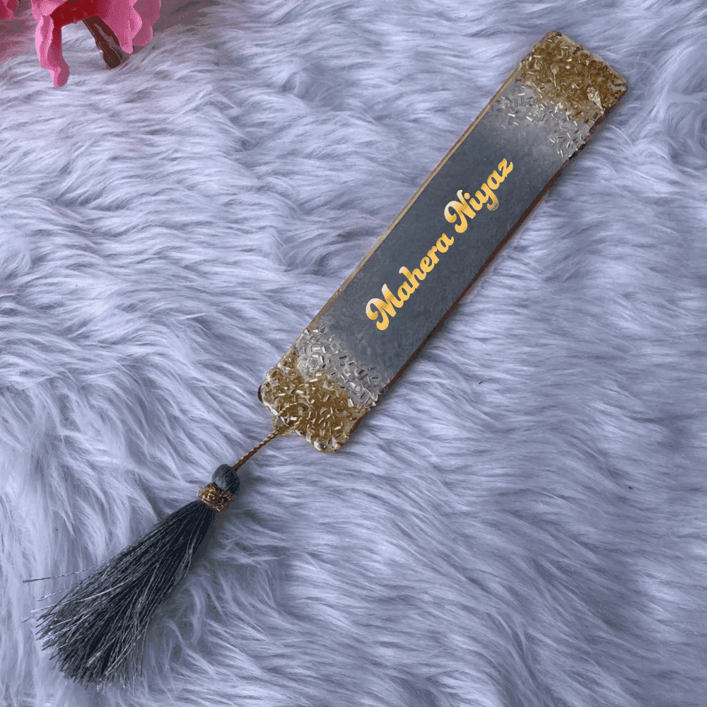 Gray and gold personalized Islamic bookmark with name 'Makera Niyaz' and matching tassel, perfect for elegant wedding favors or gifts.