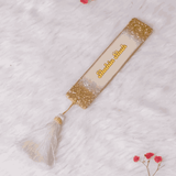 Offwhite personalised designer bookmark with gold glitter edges and name 'Shaista Shah' in calligraphy. Elegant gift for book lovers.