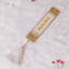 Offwhite personalised designer bookmark with gold glitter edges and name 'Shaista Shah' in calligraphy. Elegant gift for book lovers.