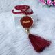Personalized maroon acrylic Tasbeeh with name tag and tassel from the Maroon Sequence Rehal Hamper - Luxury Quran Gift Set. Customizable Islamic gift.