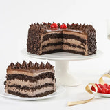 Layered Death By Chocolate Cake with fudge, ganache, and dark sponge, ideal for chocolate lovers and special occasions.