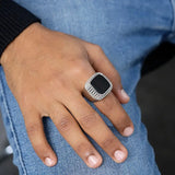 Silver Zikr Ring with 99 Swarovski Zirconia worn on hand, paired with casual jeans. Modern Islamic accessory for men and daily prayer.