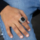 Silver Zikr Ring with 99 Swarovski Zirconia worn on hand, paired with casual jeans. Modern Islamic accessory for men and daily prayer.
