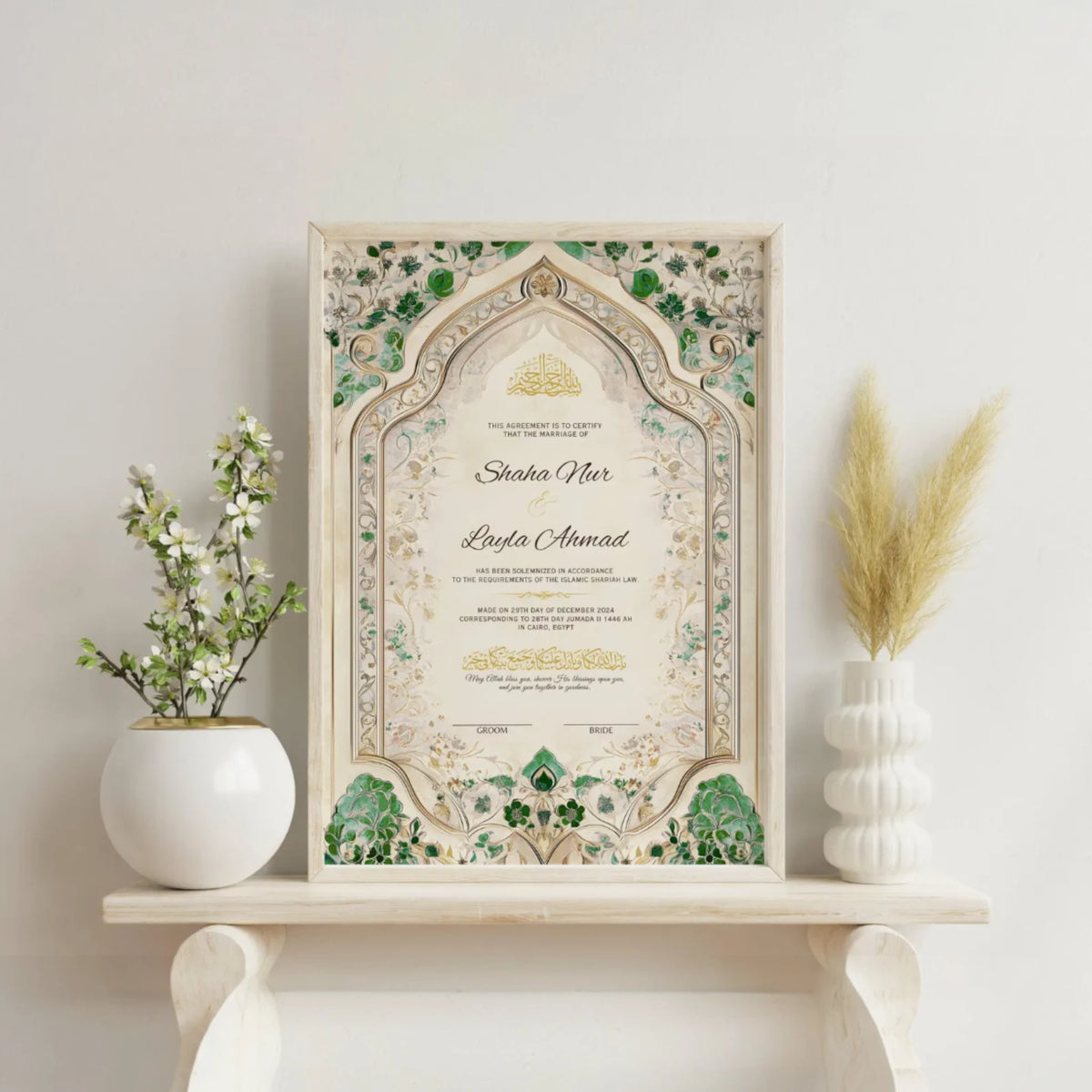 Emerald Nikah Nama Frame on a white shelf with vases and flowers, ideal Islamic wedding or anniversary gift with customizable details.