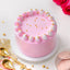 Soft Vanilla Cake - Simple Delights with light pink frosting, white and pink whipped cream swirls, and golden pearls on top. Ideal for same day delivery.