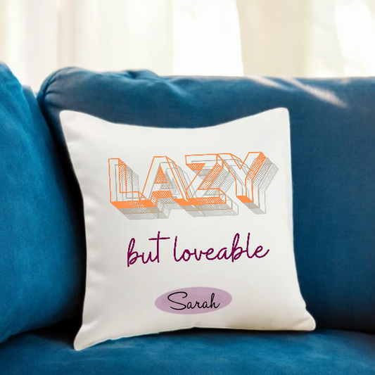 Lazy & Lovable Personalized Cushion Gift on a blue sofa, featuring custom name 'Sarah' in stylish fonts. Cozy decor for home and gifting.