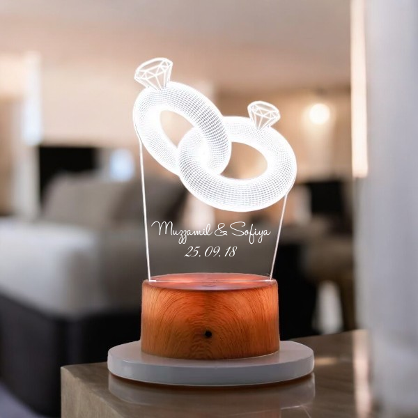 Personalized LED Lamp - Couple Ring design with names and date on a wooden finish base, perfect for romantic home decor or anniversary gifts.