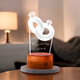 Custom Couple Ring LED Lamp with engraved names and date, featuring a glowing 3D ring design on a wooden base for personalized gifting.