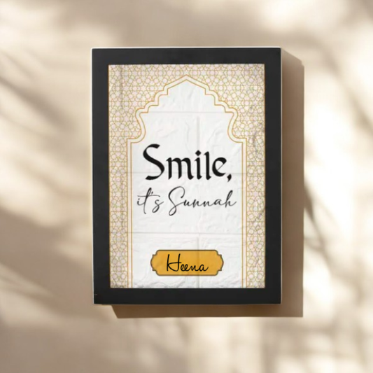 Personalized Islamic Sunnah Frame with 'Smile, it's Sunnah' quote and custom name 'Heena' in gold accent. Ideal for home decor or faith-based gifts.