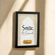Framed decorative wall art with 'Smile, it's Savannah' text on a beige background