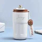 Customizable Brown Insulated Steel Flask labeled 'Jerry', featuring a spill-proof lid and stylish strap. Perfect for daily beverage use.