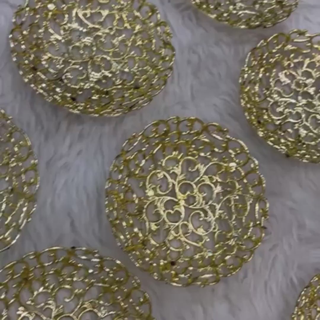 Empty decorative gold trays used for Mix Dry-Fruit Nikah Favor Gift Trays, showcasing intricate floral cut-out design on a soft background.