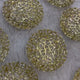Empty decorative gold trays used for Mix Dry-Fruit Nikah Favor Gift Trays, showcasing intricate floral cut-out design on a soft background.