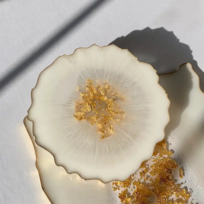 Decorative ceramic plate with gold center on a white background