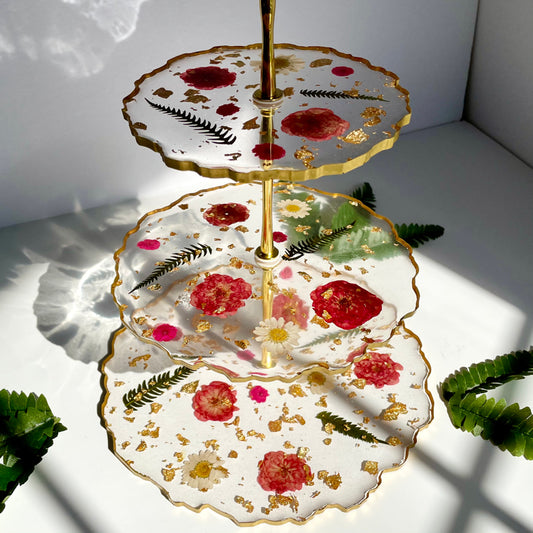 Handcrafted Floral 3 Tier Serving Stand featuring gold-trimmed resin tiers with embedded flowers, ideal for stylish home decor or gifting.
