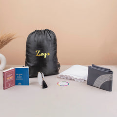 Safar-e-Imaan Women Mini Set includes essentials for Hajj & Umrah like hijab, tasbeeh, prayer mat, and Islamic books in a custom travel bag.