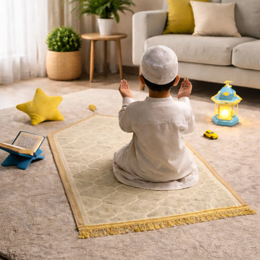 White Kids Dome Janamaz - Kids Dome Prayer Rug shown in a cozy living room with a child praying, ideal for ages 3 to 10. Soft, foldable, and portable.
